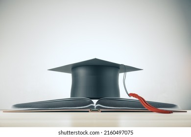 Higher Education And Study Concept With Black Mortarboard Hat On Opened Book On Light Background. 3D Rendering
