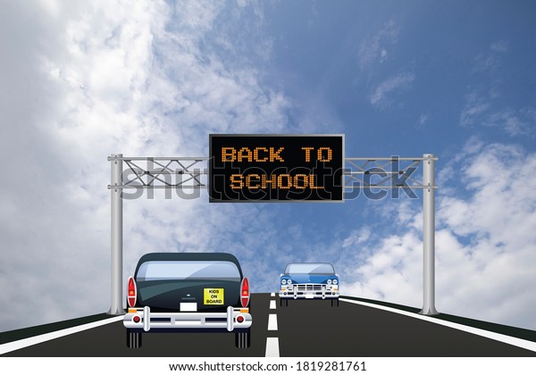 Highway digital overhead gantry sign\
with back to school message and traffic on the\
road