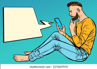 Hipster man sitting on the floor and reading smartphone. Pop art retro  illustration kitsch vintage