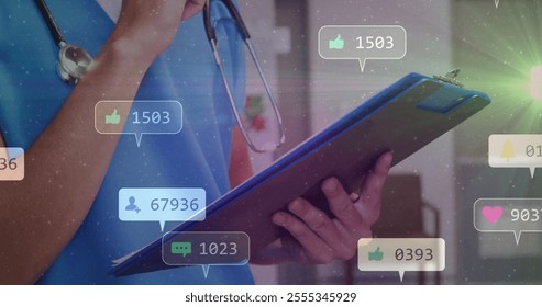 Holding clipboard, medical professional with social media notifications image. Healthcare, technology, digital, business, online, alerts - Powered by Shutterstock