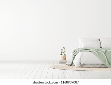 Home Bedroom Interior Mockup With Bed, Green Plaid, Pillows, Rug And Plants On Empty White Wall Background. Free Space On Left. 3D Rendering.