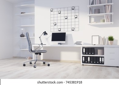 Home Office Corner With A Wooden Floor, A Computer Desk, Photos On A White Wall And Shelves. 3d Rendering Mock Up