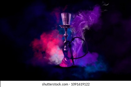 Hookah on a beautiful oriental background, smoke