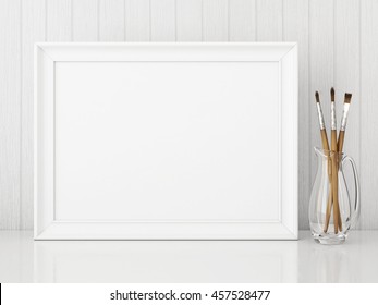 Horizontal Interior Poster Mock Up With Empty White Frame And Art Brushes On Wooden Background. 3D Rendering.