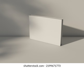 Horizontal Photo Book Album Mockup Standing On White Table. 3d Rendering