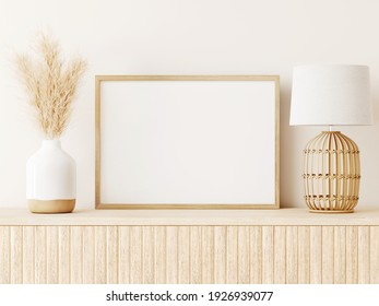 Horizontal poster art mockup with beige wooden frame, dried grass in vase, wicker basket lamp on empty warm white background. Japandi interior decoration. A4, A3 format. 3d rendering, illustration. 