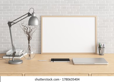 Horizontal Poster Frame Mockup On The Wooden Table Of Home Studio Workspace With White Brick Wall. Front View, Clipping Path Around Poster Picture. 3d Illustration