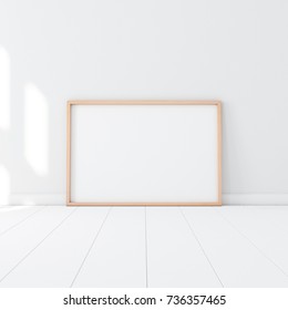 Horizontal Wooden Poster Frame Mockup Standing On The White Floor In Empty Room. 3d Rendering