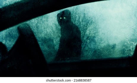 A Horror Concept Of A Spooky Supernatural Figure With Glowing Eyes. Looking Into A Car Window On A Stormy Winters Evening.