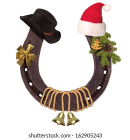 Horseshoe and Christmas elements with Santa hat and cowboy hat isolated on white for design