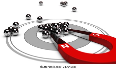 Horseshoe magnet attracting metal balls in the center of a grey target. Image concept of inbound marketing or advertising.