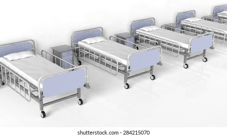 Hospital beds and bedside tables in a row
