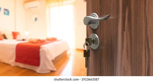 Hotel room with keys on half open wooden door. Motel luxury, clean bedroom with metallic handle. Blur room interior background. Banner. 3d illustration