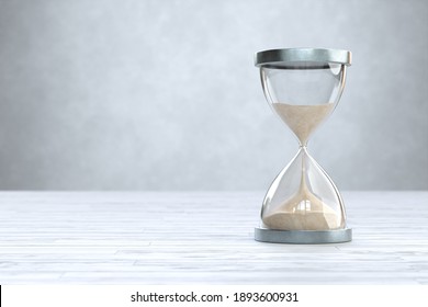 Hourglass on Wooden floor with copy space, sandglass. 3d illustration