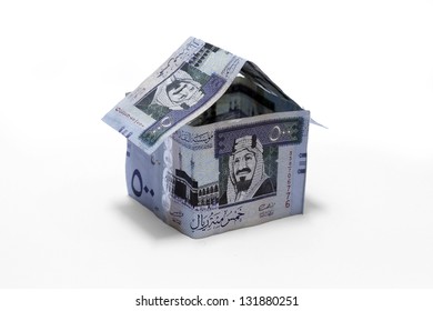 House Origami Made Of Saudi Money Isolated On White Background