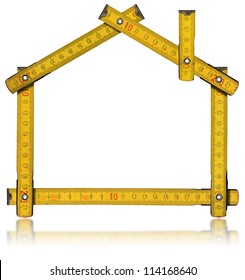 House - Wood Meter Tool / Wooden Yellow Meter Tool Forming A House With Reflection On White Background