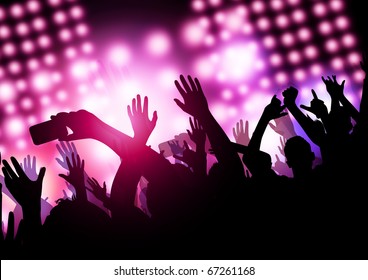 A huge excited crowd at a concert. - Powered by Shutterstock