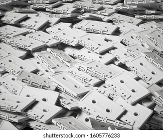 Huge pile of unlabelled diffuse white retro analogue music cassette tapes under clean lighting. This image is a 3d render.