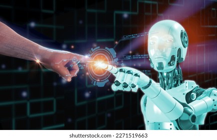 human finger touching 3D robotic finger at glow with element futurictic document digital icon, AI artifical intelligence emulate human work and better - Powered by Shutterstock