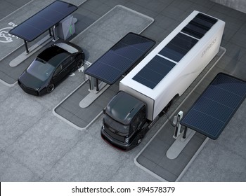 Hybrid Electric Truck And White Electric Car In Charging Station