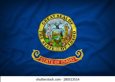 Idaho flag on the fabric texture background,Vintage style
