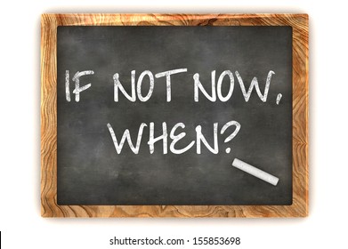 "If not now, when?" handwritten with white chalk on a blackboard 