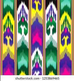 Ikat is Asian silk material. Fabric adras, Uzbek national pattern. Colorful background.