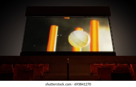 An Illuminated Stadium Big Screen Showing A Cricket Replay In The Stands In The Night Time - 3D Render