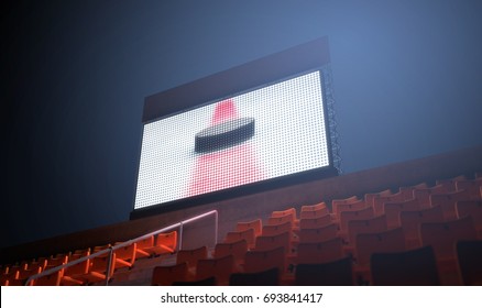 An Illuminated Stadium Big Screen Showing A Hockey Replay In The Stands In The Night Time - 3D Render