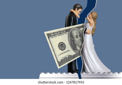 To Illustrate How Money Issues Can Come Between Couples And Cause Divorce, A One Hundred Dollar Bill Comes Between A Bride And Groom Wedding Cake Topper. This Is A Photo-illustration.