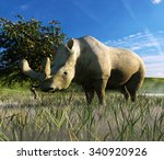 An illustration depicting Brontotherium in a misty grassland. Brontotherium an extinct group of rhinoceros-like browsers related to horses. It was endemic to North America during the Late Eocene epoch