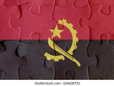 Illustration Of A Flag Of Angola Over Some Puzzle Pieces. Its A JPG Image.