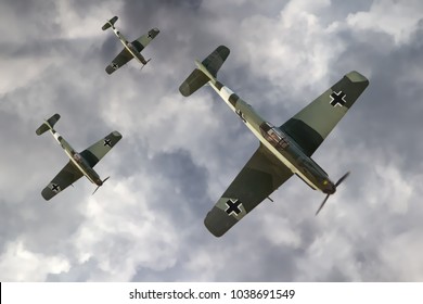 Illustration Of A German Fighter Planes Of WW2 Flying Above The Clouds.