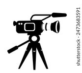 Illustration of a modern film camera on a camera tripod. Film camera, tripod, swivelling head, microphone, interchangeable lens, lens hood as black, simplified symbols. Isolated against white.