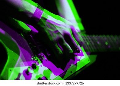 Illustration of professional musician playing electric guitar on stage with 3d stereo effect.Guitarist plays live set on rock concert in music hall.Retro anaglyph filter,neon green & magenta lights - Powered by Shutterstock