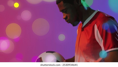 Image of african american male soccer player over spots. Global sport and digital interface concept digitally generated image. - Powered by Shutterstock