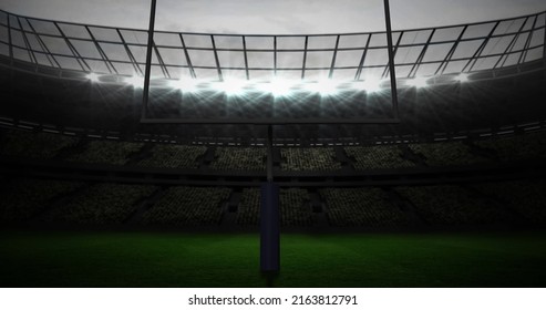 Image of american football goalposts and cloudy sky at floodlit stadium. sports, competition, american football concept digitally generated image.