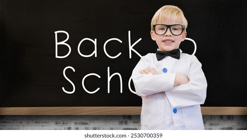 Image of back to school text and schoolboy over blackboard. education, development and learning concept digitally generated image.