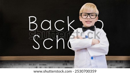 Image of back to school text and schoolboy over blackboard. education, development and learning concept digitally generated image.