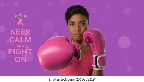 Image of breast cancer awareness text over biracial female boxer. breast cancer positive awareness campaign concept digitally generated image. - Powered by Shutterstock