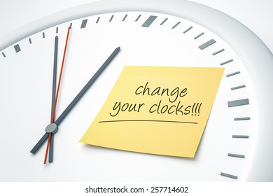 An Image Of A Bright Clock With A Sticky Note And The Message Change Your Clocks