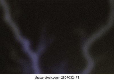 The image captures a dark, moody scene with faint, ethereal blue-purple vapor or light emanating from the lower center. The glow appears soft and diffused, blending into the surrounding darkness, creating an eerie and otherworldly atmosphere. The composition suggests a focus on the contrast between the luminous vapor and the enveloping blackness, evoking a sense of mystery and intrigue. The lack of additional context or objects directs attention solely to the glowing phenomenon itself, emphasizing its enigmatic presence in the scene.