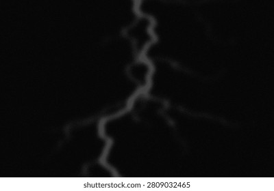 The image captures a subtle and faint lightning bolt cutting through a dark, cloudy night sky. The strike is barely visible, creating a ghostly, almost translucent effect against the black backdrop. The lightning appears to branch out slightly, highlighting the intricate paths electricity takes during a storm. The overall ambiance is mysterious and serene, emphasizing the fleeting nature of the phenomenon.