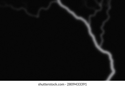 The image captures a subtle, luminous lightning bolt branching across a dark expanse. The faint glow of the lightning contrasts sharply with the surrounding blackness, highlighting its ethereal and delicate form. The streak appears to curve and split, creating a striking visual effect that emphasizes the transient and powerful nature of lightning in a night sky setting.
