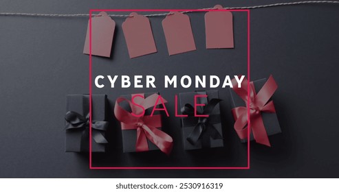 Image of cyber monday sale text over gift tags and boxes on black background. Cyber monday, online shopping, shipping and global connections concept digitally generated image. - Powered by Shutterstock