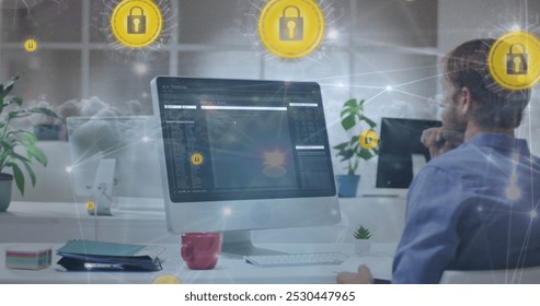 Image of data processing and clouds over caucasian businessman using computer. Computer security day and celebration concept digitally generated image.