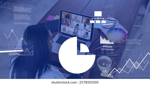 Image of data processing and diagrams over diverse female teacher and students having video call. Technology, education and digital interface concept digitally generated image.
