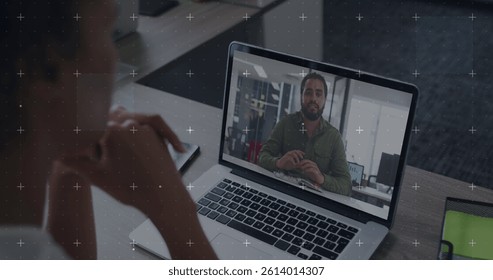 Image of data processing over biracial businesswoman on laptop image call. cloud computing and data processing concept digitally generated image.