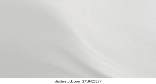 The image depicts a plain, light-colored surface with a soft, diffused light source casting a subtle shadow. The lighting creates a gentle gradient, adding depth and a serene ambiance to the otherwise simple background.
