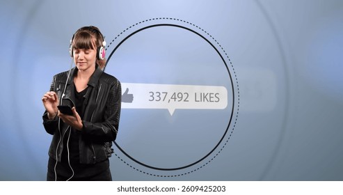 Image of digital interface thumbs up with growing numbers on white speech bubble and woman listening to music with headphones and smartphone. Global social media network digitally generated image. - Powered by Shutterstock - Get 15% off with code: PIKWIZARD15